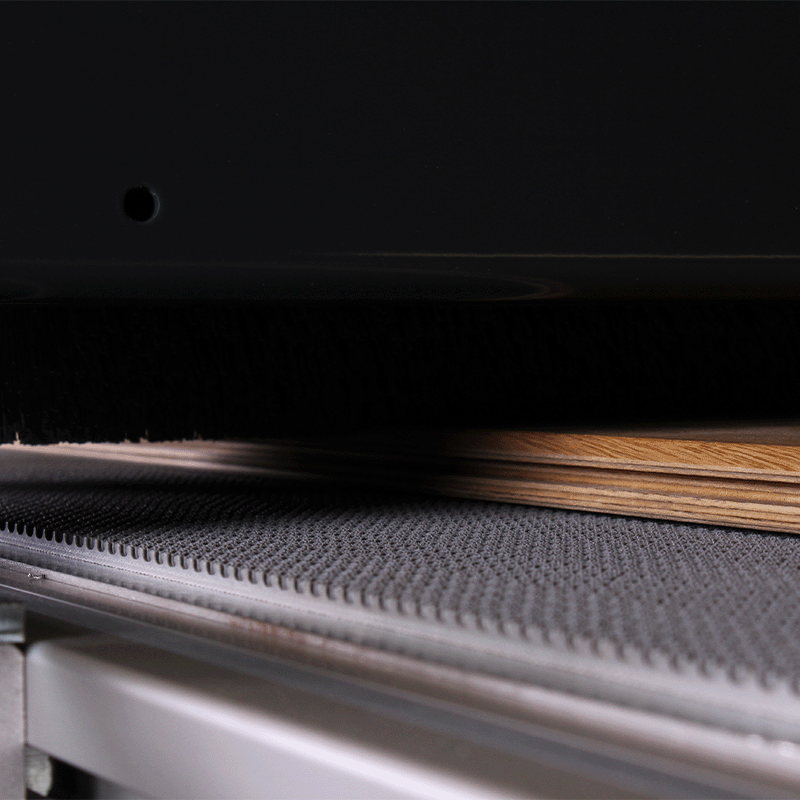 Brush sanding machine close up brushing plank